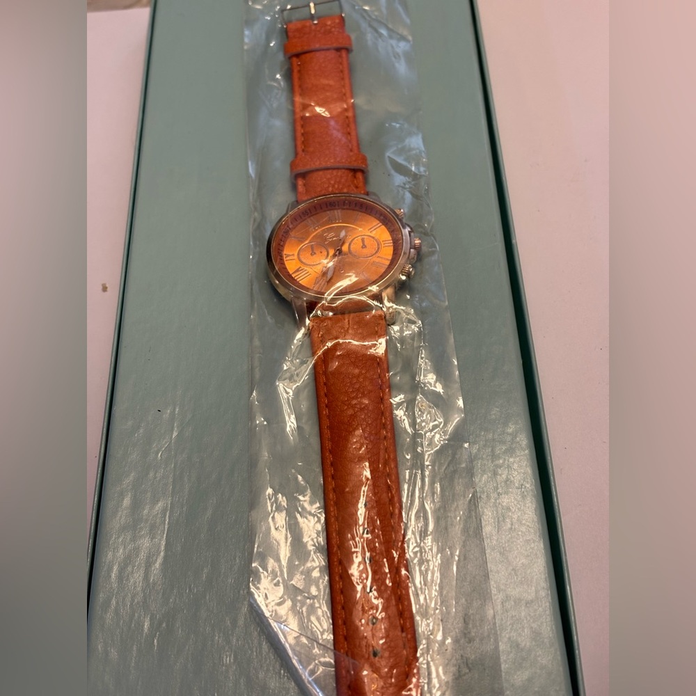 Elegant Rose Gold Chronograph Watch with Orange Leather Strap